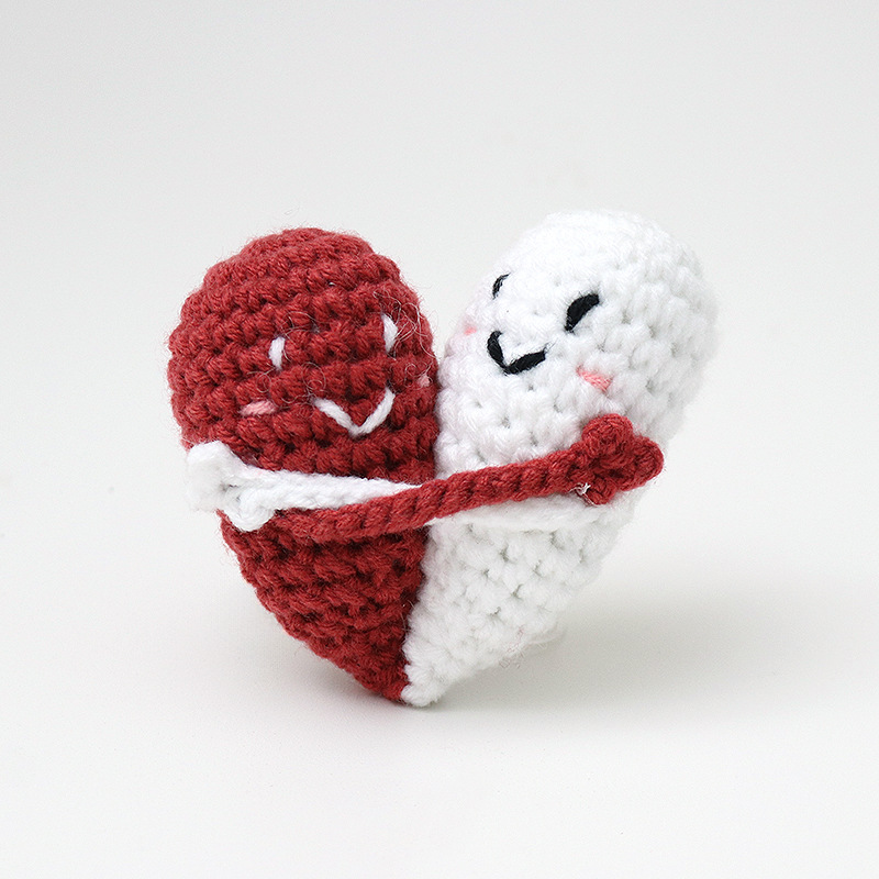 Cute handmade crocheted positive energy doll heart hug emoji pack, a knitted gift for couples.