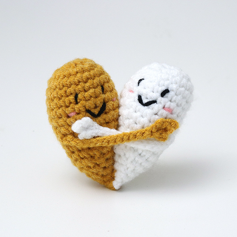 Cute handmade crocheted positive energy doll heart hug emoji pack, a knitted gift for couples.