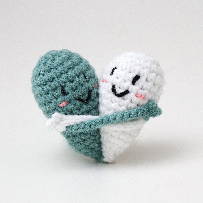 Cute handmade crocheted positive energy doll heart hug emoji pack, a knitted gift for couples.