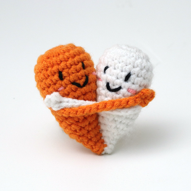 Cute handmade crocheted positive energy doll heart hug emoji pack, a knitted gift for couples.