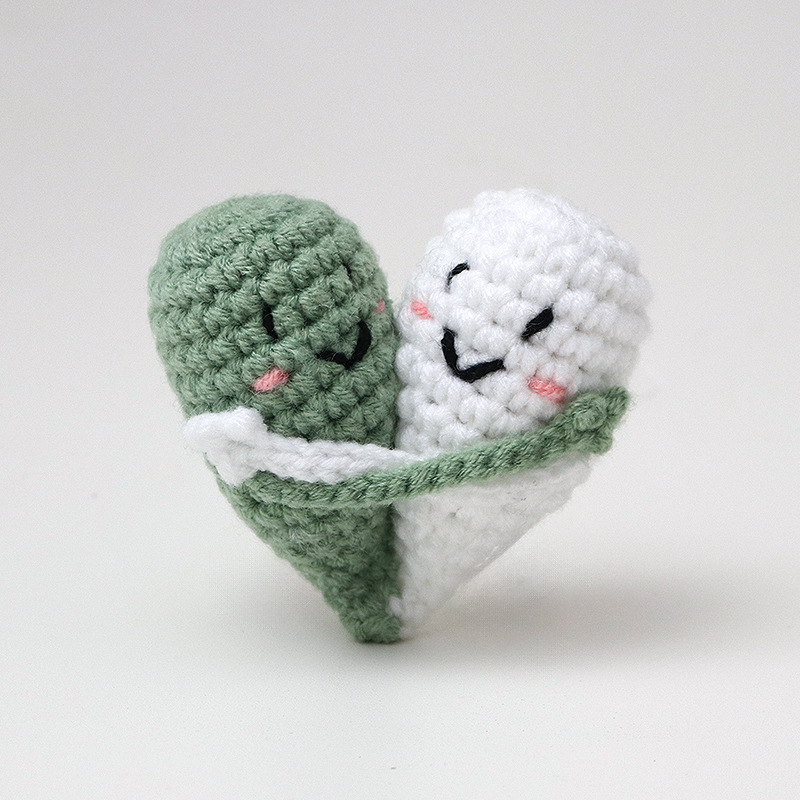 Cute handmade crocheted positive energy doll heart hug emoji pack, a knitted gift for couples.