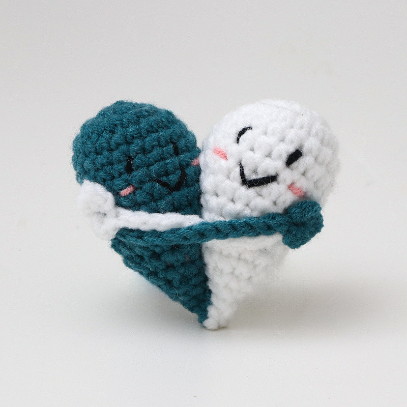 Cute handmade crocheted positive energy doll heart hug emoji pack, a knitted gift for couples.
